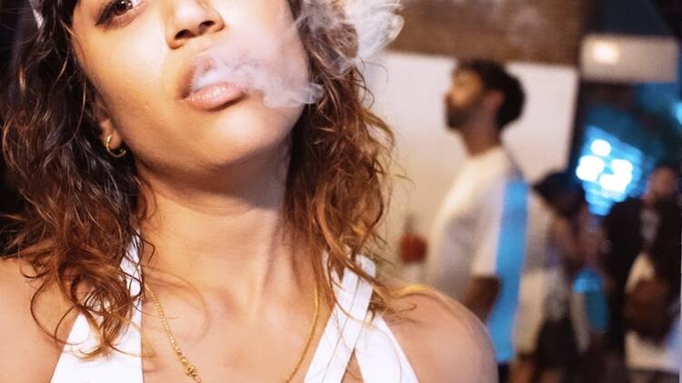 A woman smoking weed.