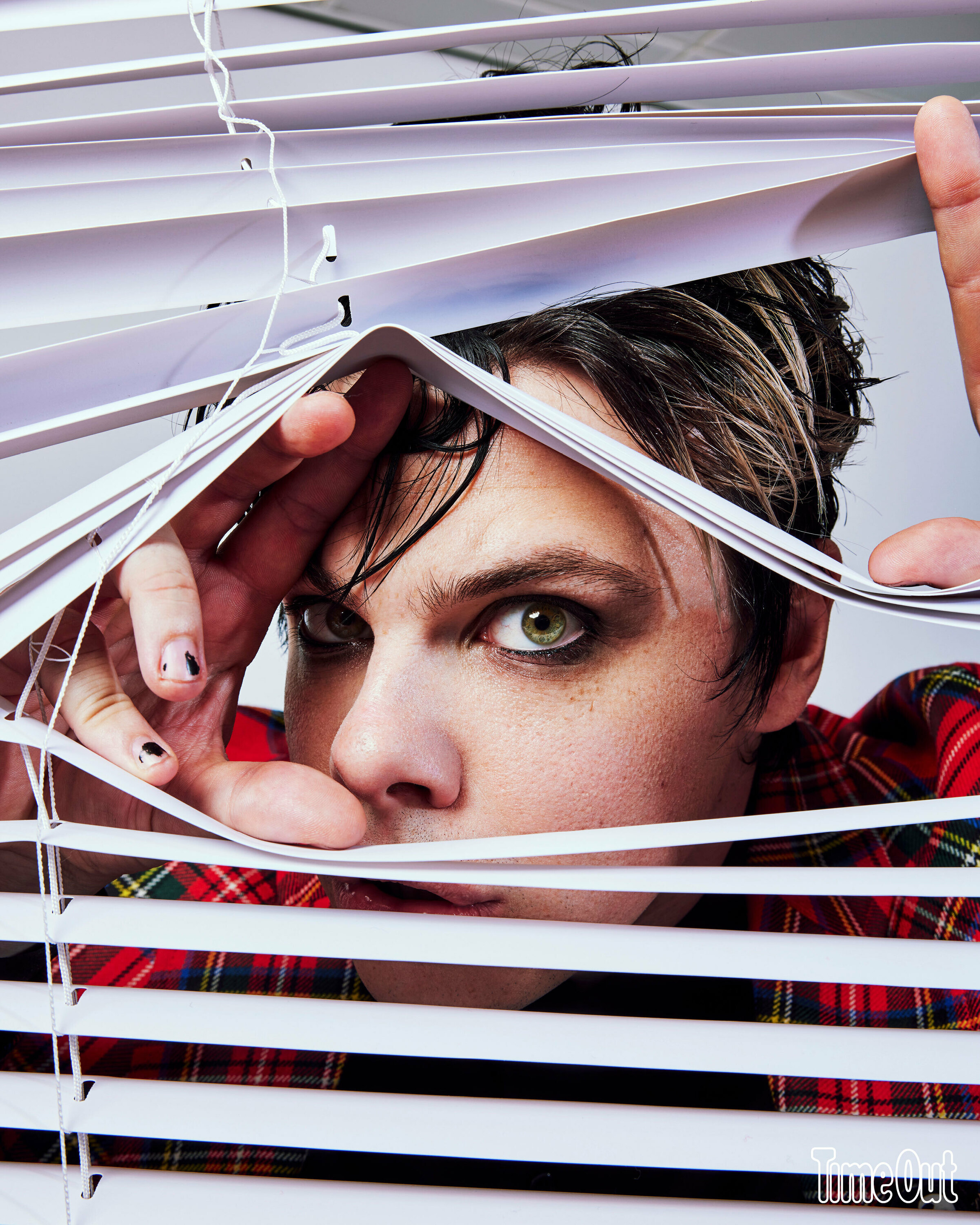 Yungblud looking through blinds