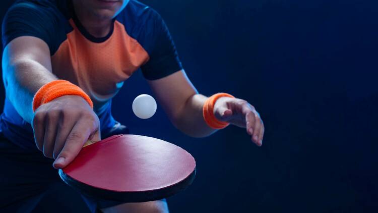A person playing table tennis