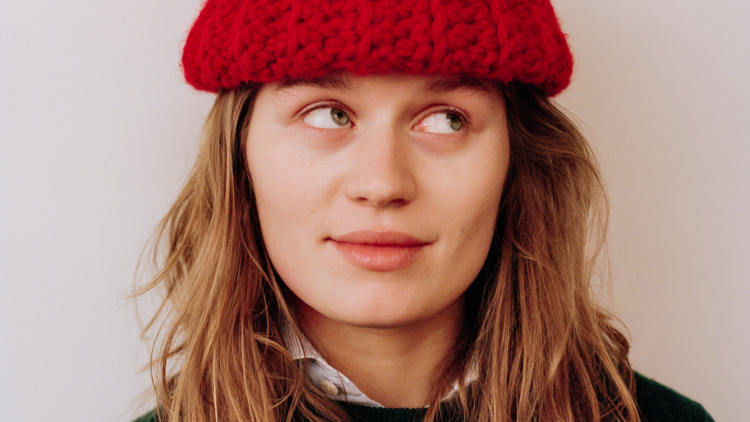 Girl in Red wears big red beanie