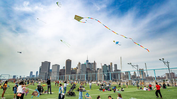 Kites soar over the Manhattan skyline.