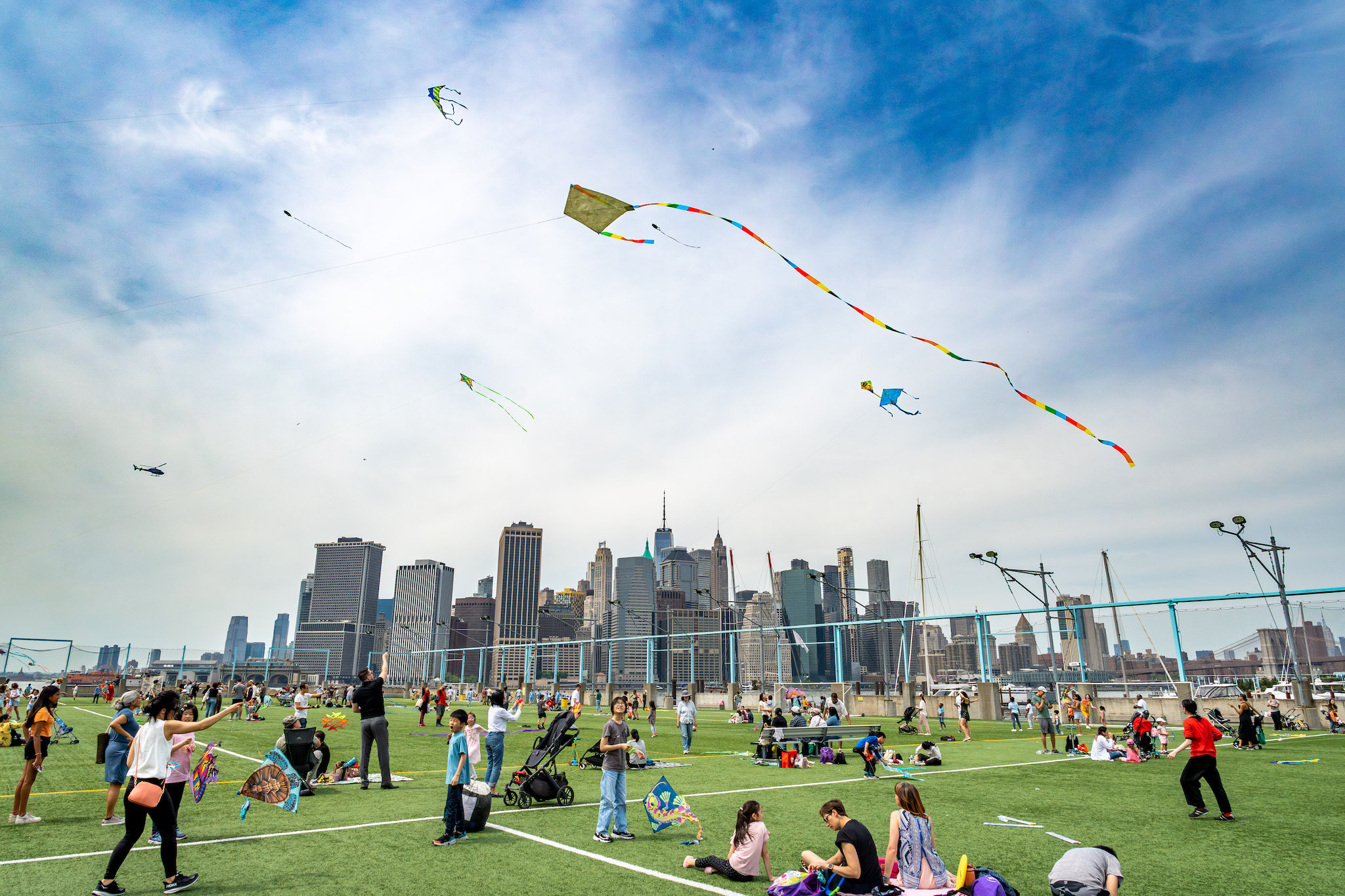 Kites soar over the Manhattan skyline.