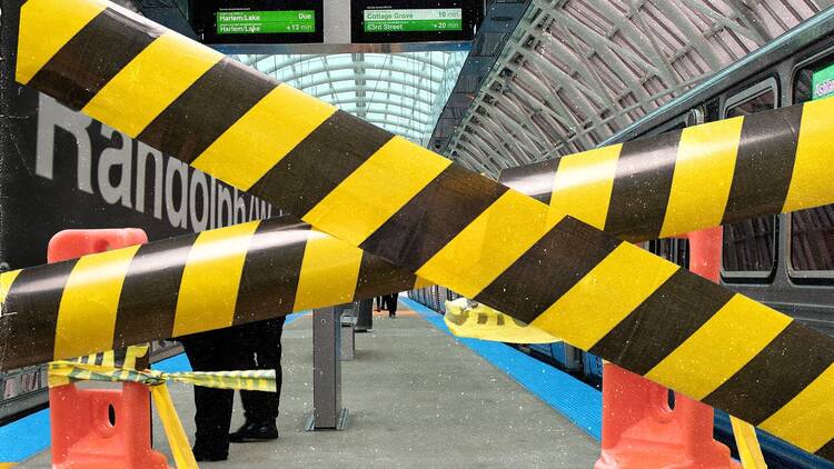 construction tape in front of a train station