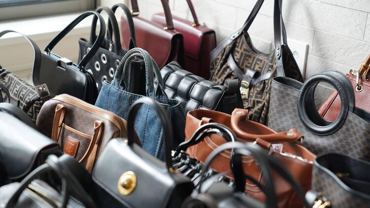 Designer handbags placed in a row 