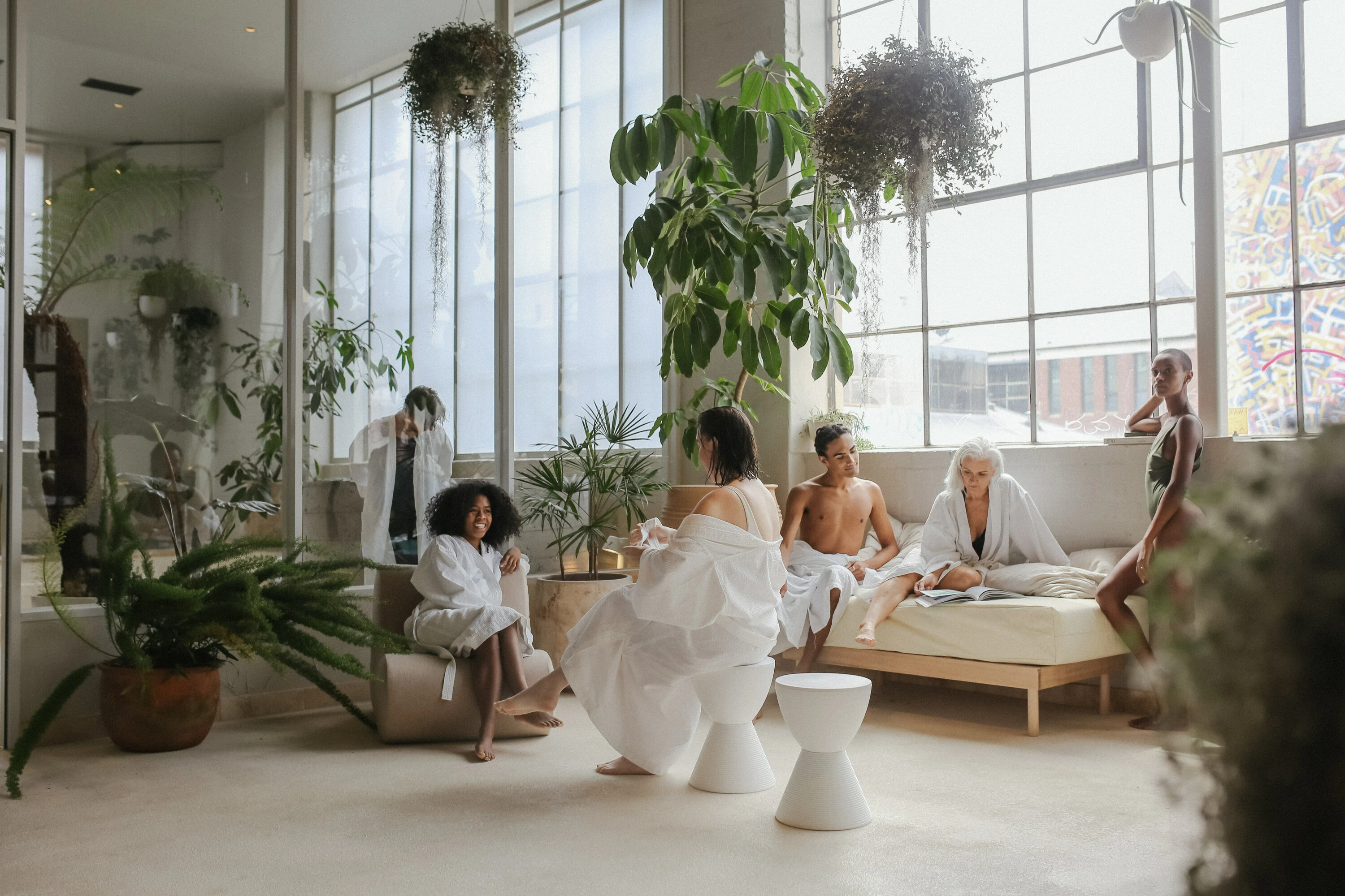 Multiple people sit at Sense of Self relaxing