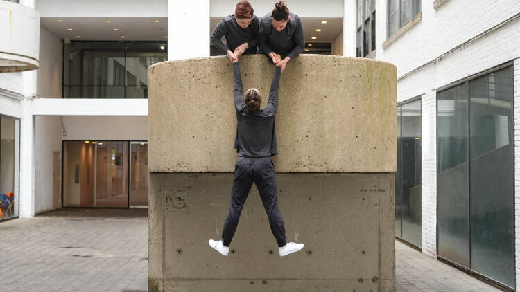 Three dance performers.