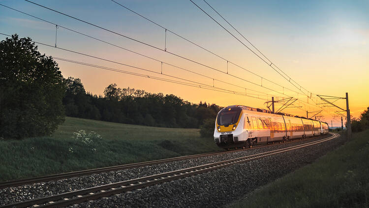 Train in the countryside at sunset