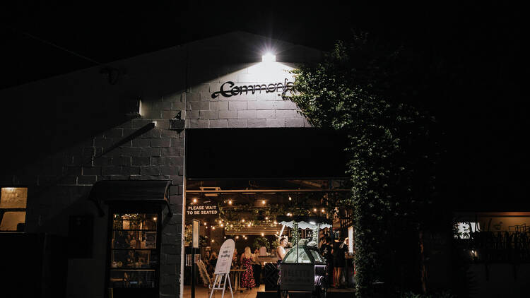 The exterior of Mornington eatery Commonfolk at night.