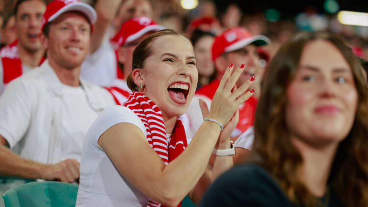 woman at a swans game cheering