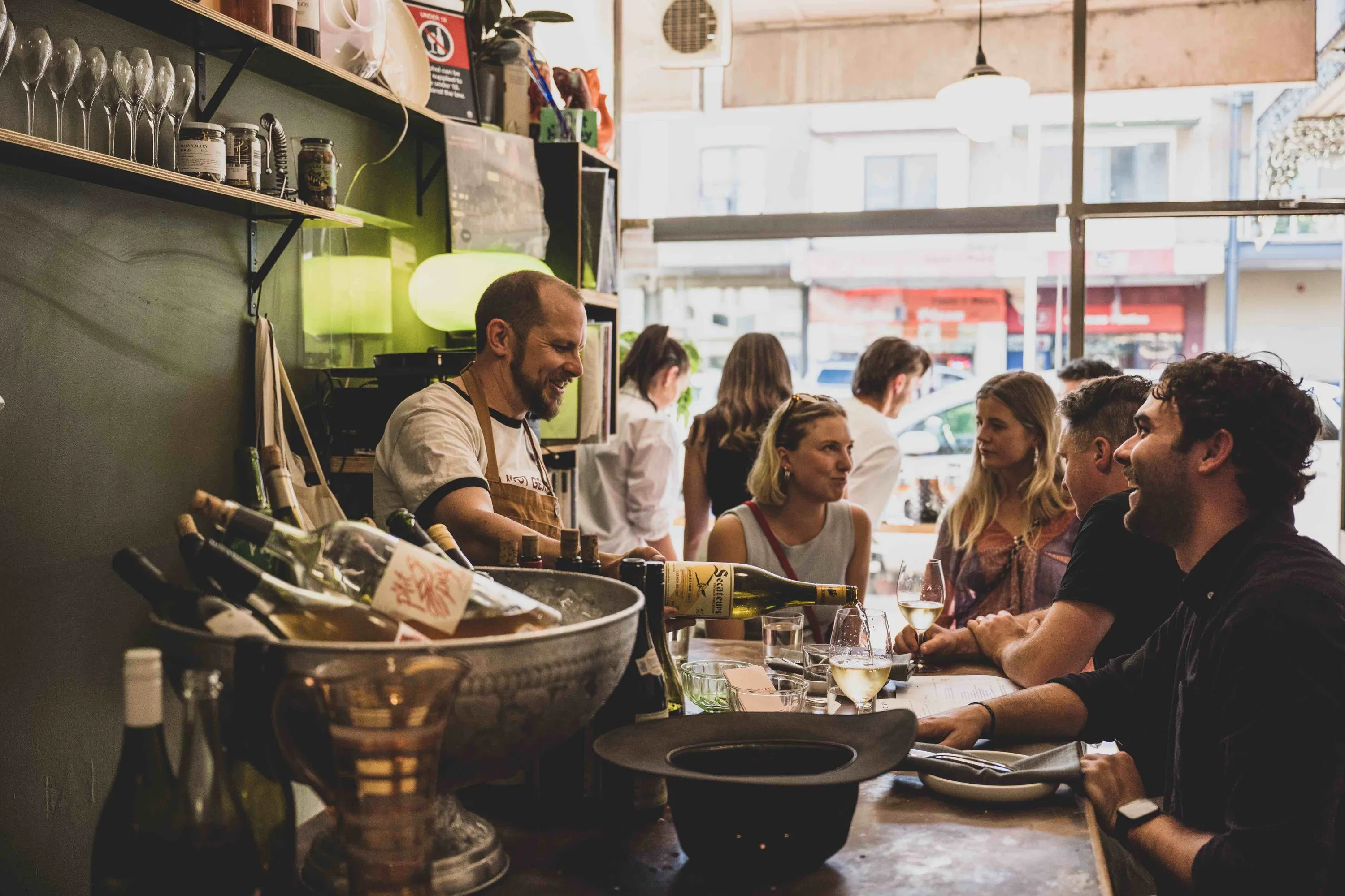 People enjoying wines and snacks at Hey Rosey