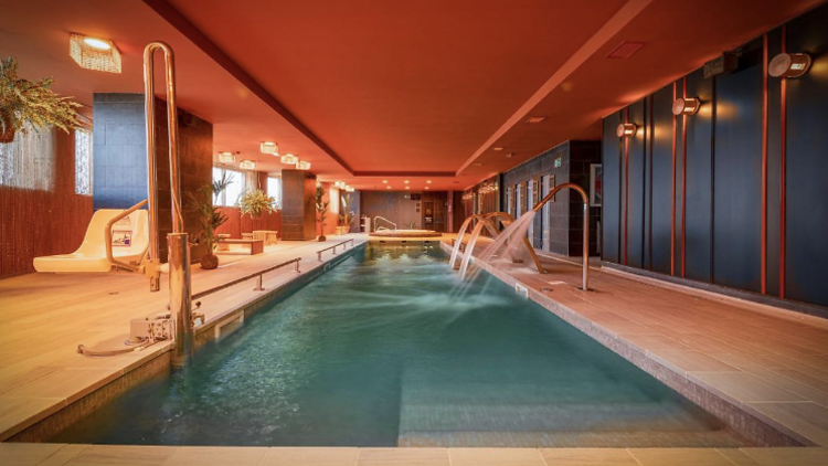 Warmly lit Indoor pool in Melia Valencia.