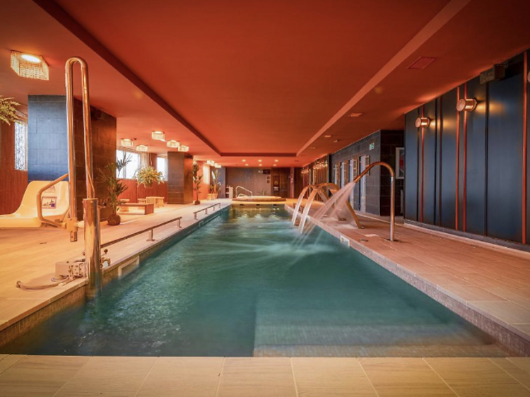 Warmly lit Indoor pool in Melia Valencia.