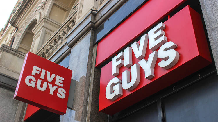 Picture of the red logo sign of Five Guys burger chain 