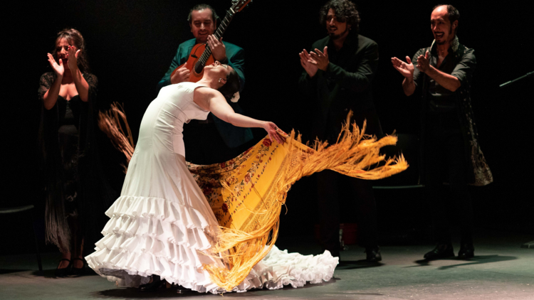 A flamenco dancer does a backbend