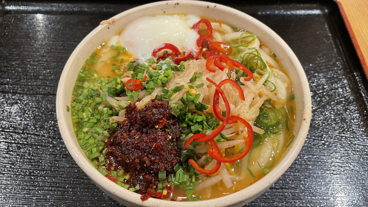 Bowl of noodles with chilli sauce