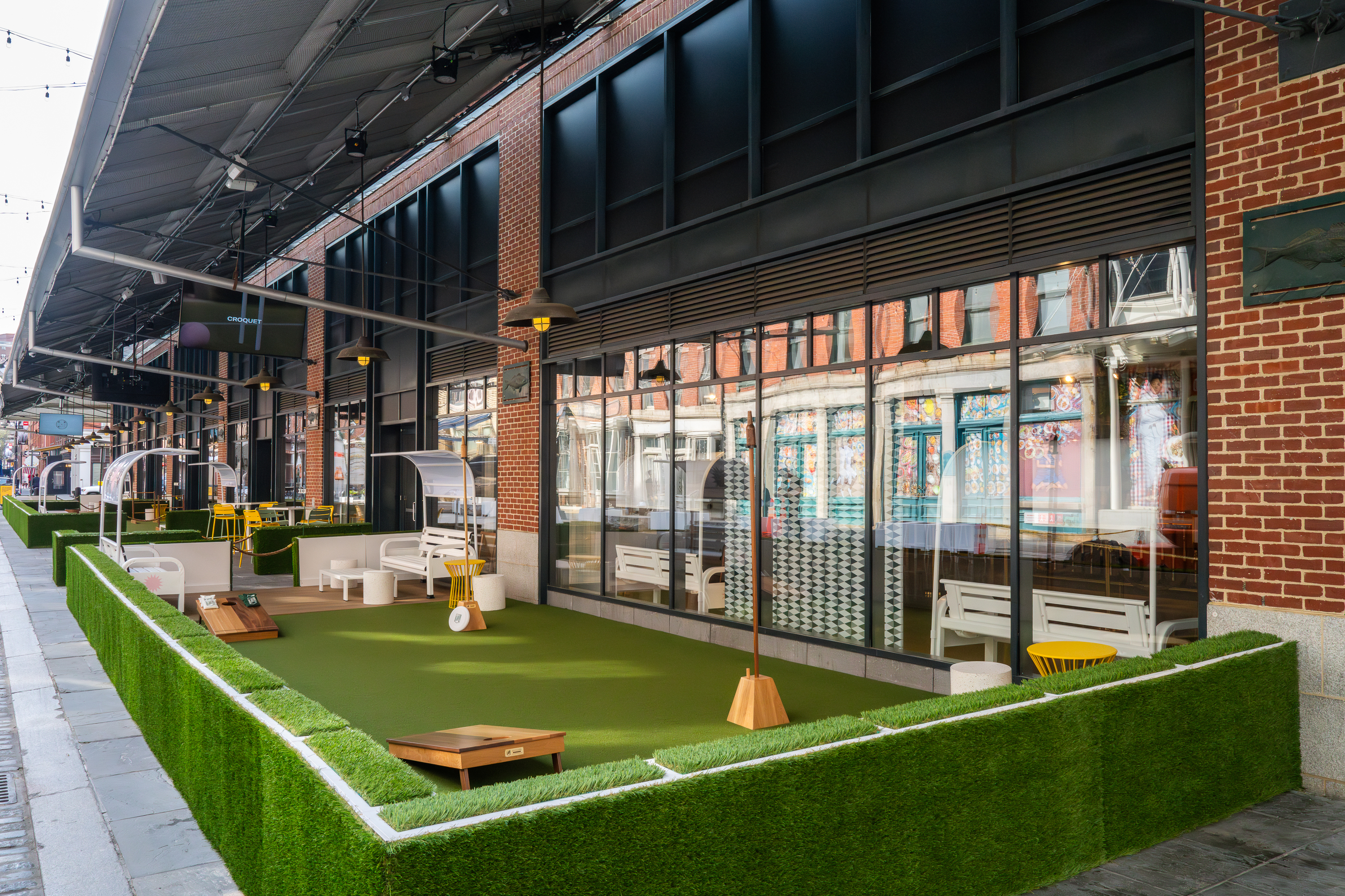 Exclusive: The outdoor Lawn Club with TV screens and more just opened by the Seaport