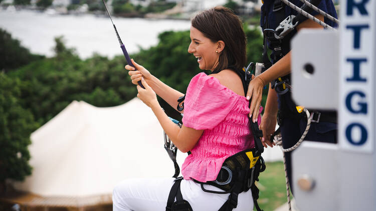 Woman abseiling off building