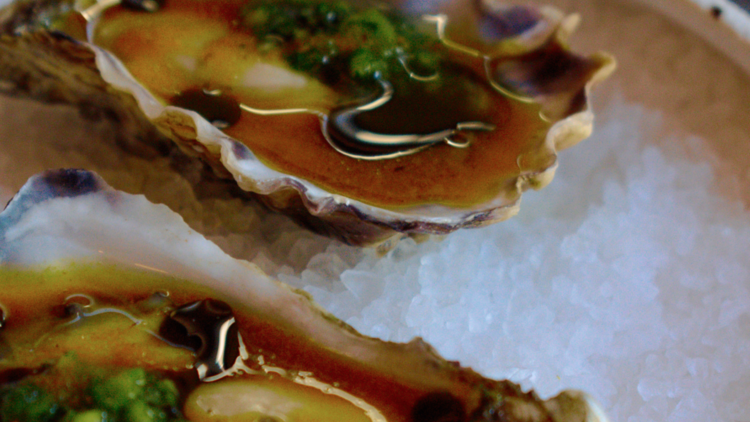 Natural oysters with aged pinakurat and green chilli relish.
