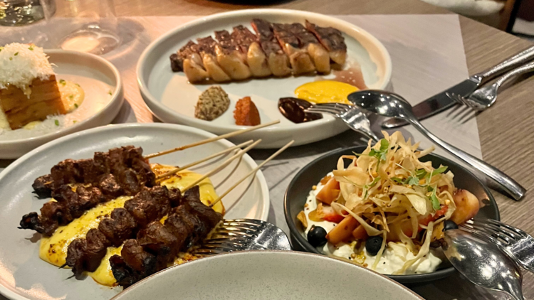 A spread of skewers and meat dishes