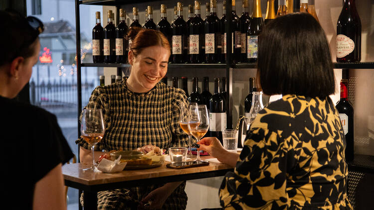 Friends drinking in a wine bar