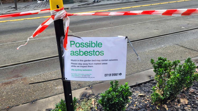 City of Sydney sign on a street about 'Possible asbestos'