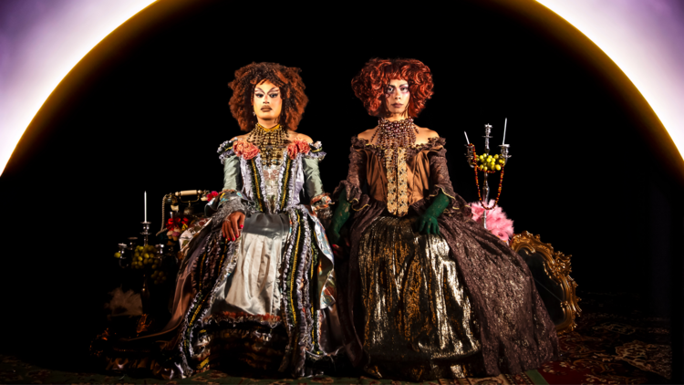 Two drag queens in elaborate gowns