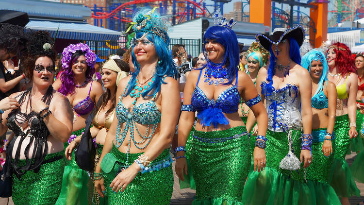 Women dressed in a costume for the annual Coney Island Mermaid Parade, the largest art parade in the nation.