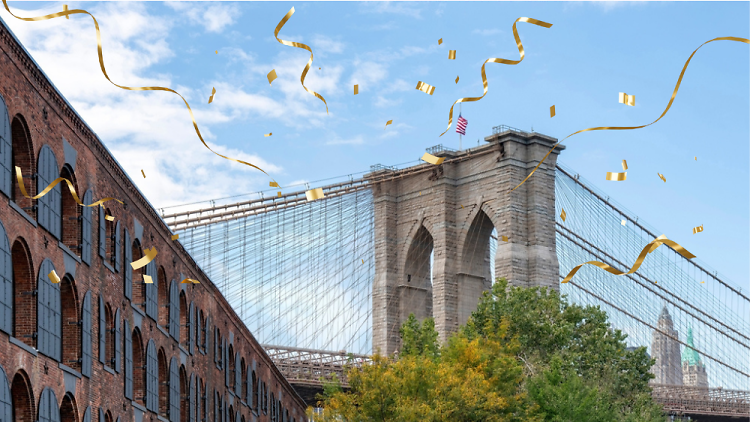 Empire Stores and the Brooklyn Bridge with confetti