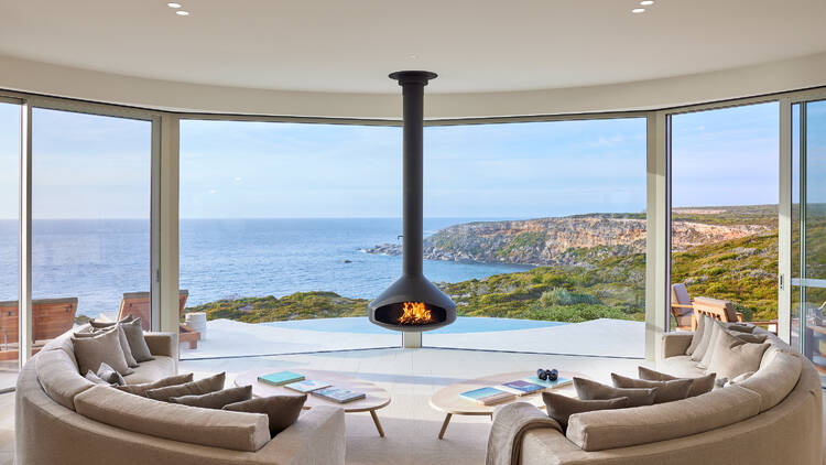 Hotel lobby with fireplace and water views