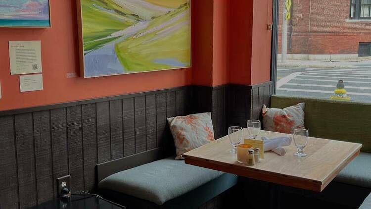 A cozy dining nook at Vee Vee in Jamaica Plain overlooks Centre Street