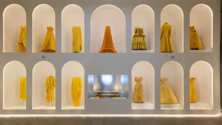 Yellow dresses arranged at The Met.