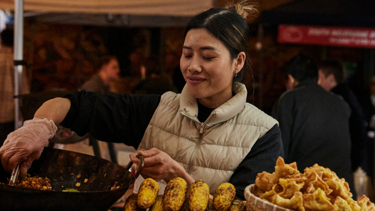 Vendor preparing food.