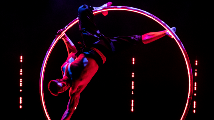 A cyr wheel artist onstage