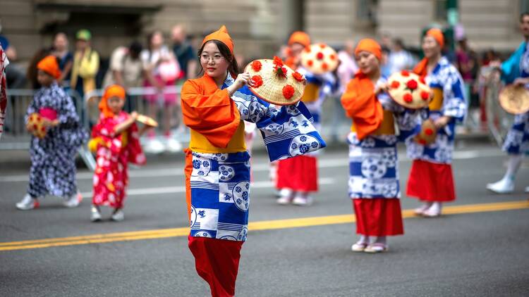 People walk in the Japan Day parade.