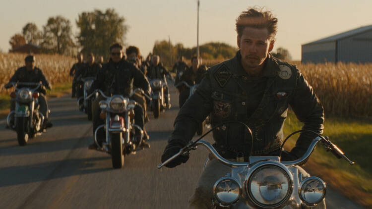 A man on a bike in a motorcycle gang