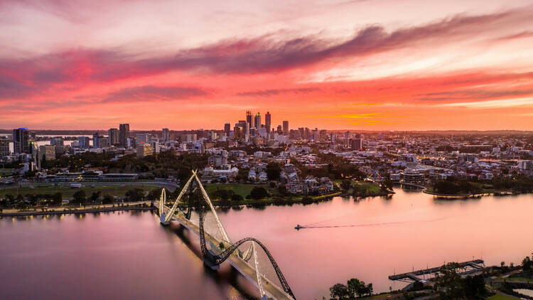 Aerial View of the sun rising above Matagarup Bridge, Perth