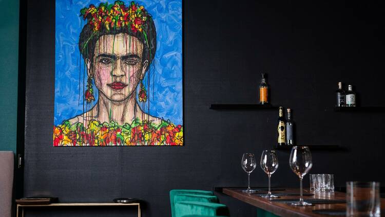 carino chefs counter and painting of frida kahlo