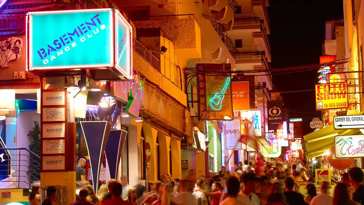 Ibiza San Antonio nightlife, people on the street outside a nightclub
