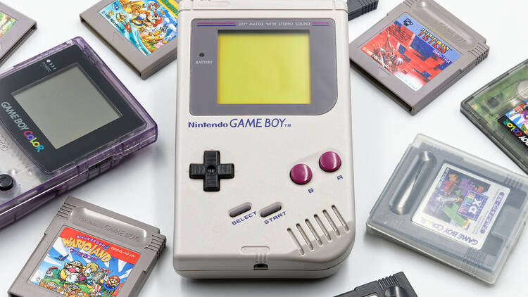 Nintendo Game Boy surrounded by games