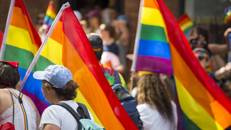 people march with pride flags