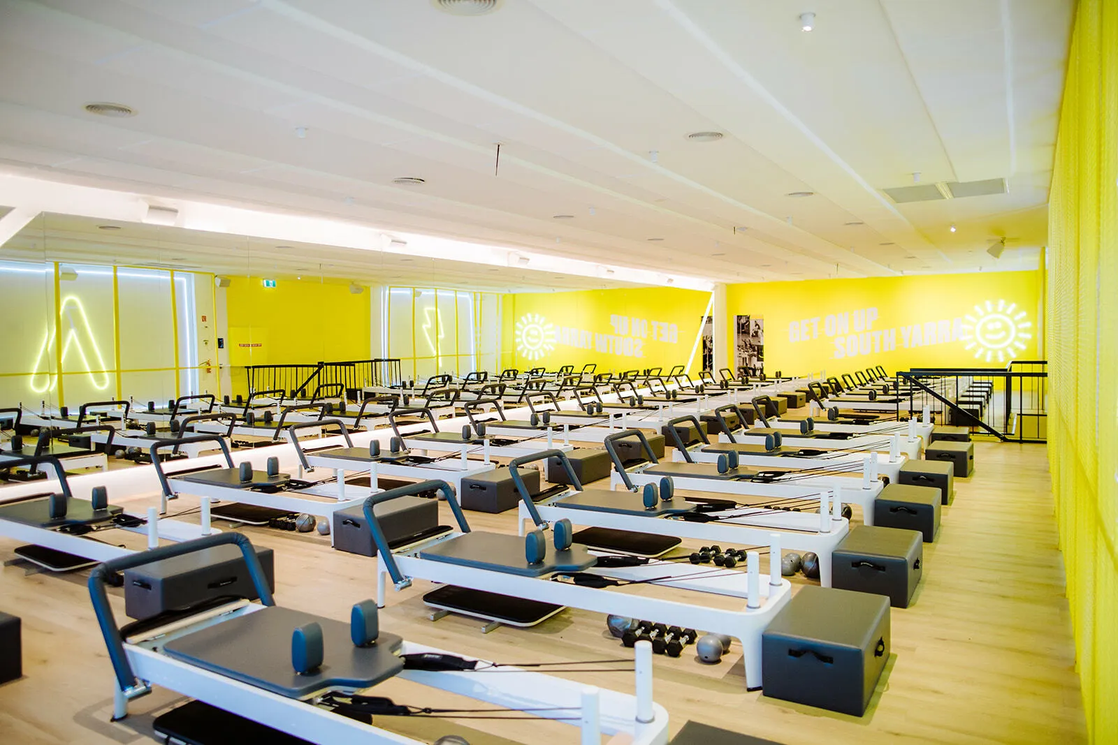A room filled with reformer machines.