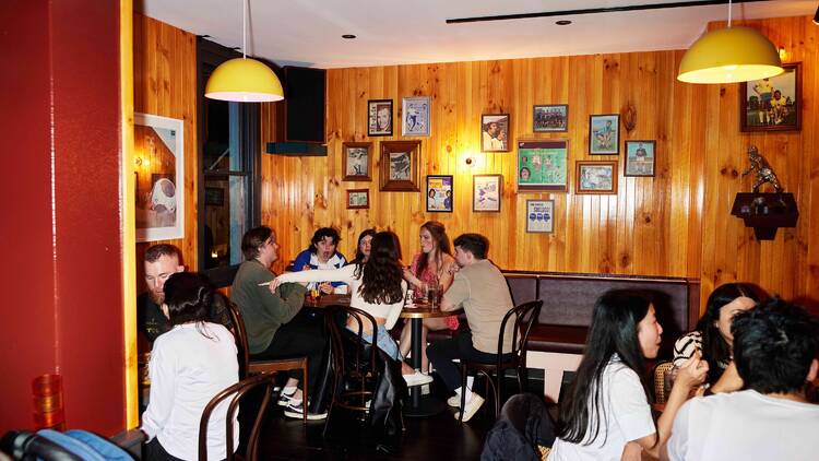 People sitting down at Ricos Tacos