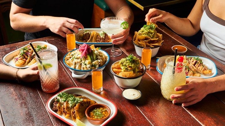 Spread of tacos and drinks