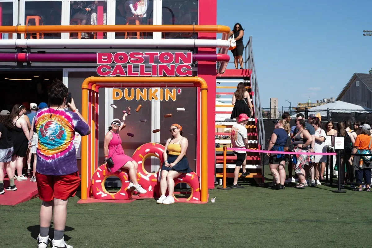 Fans pose at the House of Dunkin' at Boston Calling on Friday, May 24, 2024
