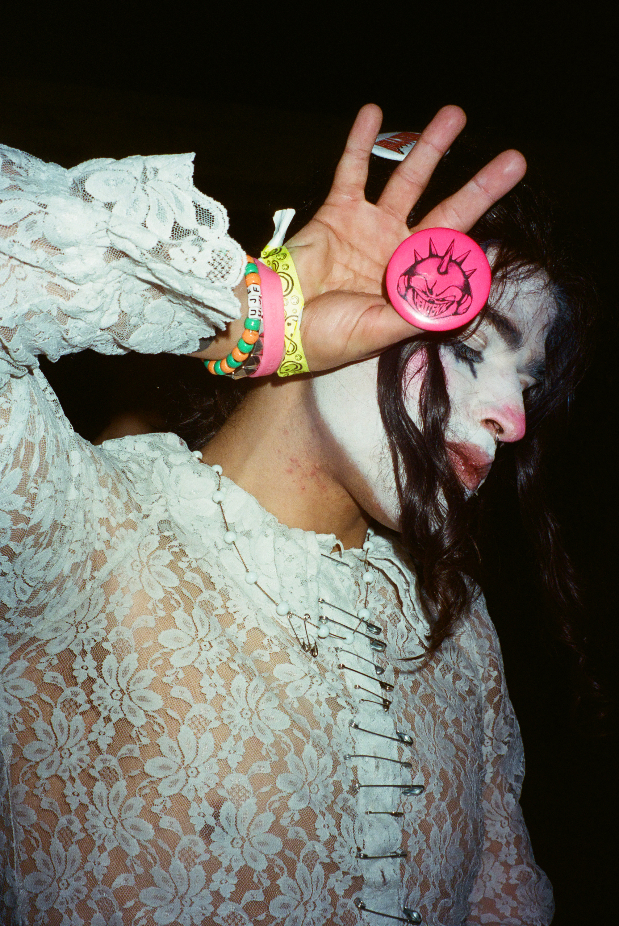 person in clown makeup posing for the camera