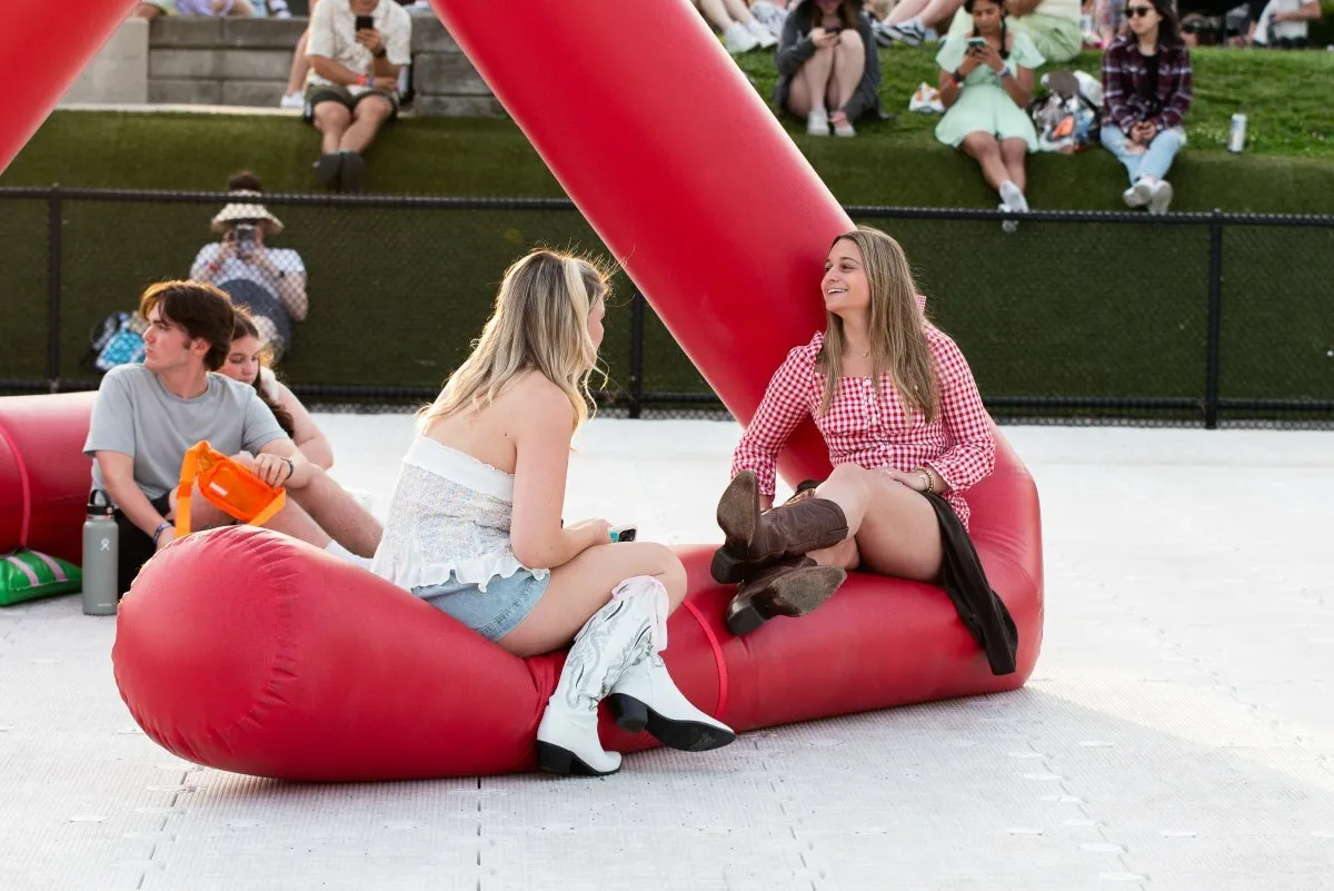 Attendees of Boston Calling on Saturday, May 25, relax on an installation.