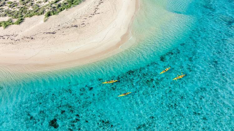 Aerial view of Osprey Bay, Ningaloo with kayakers