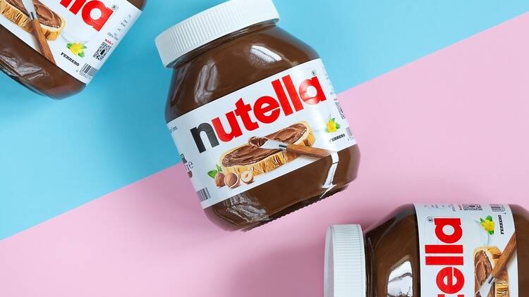 Pots of Nutella on a colourful background