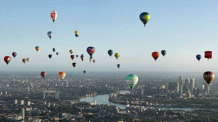 Lord Mayor’s Hot Air Balloon Regatta in London, with hot air balloons flying high above the city