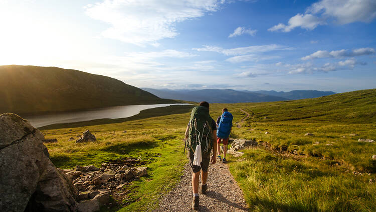 Tourists trekking in the Scottish Highlands, Scotland